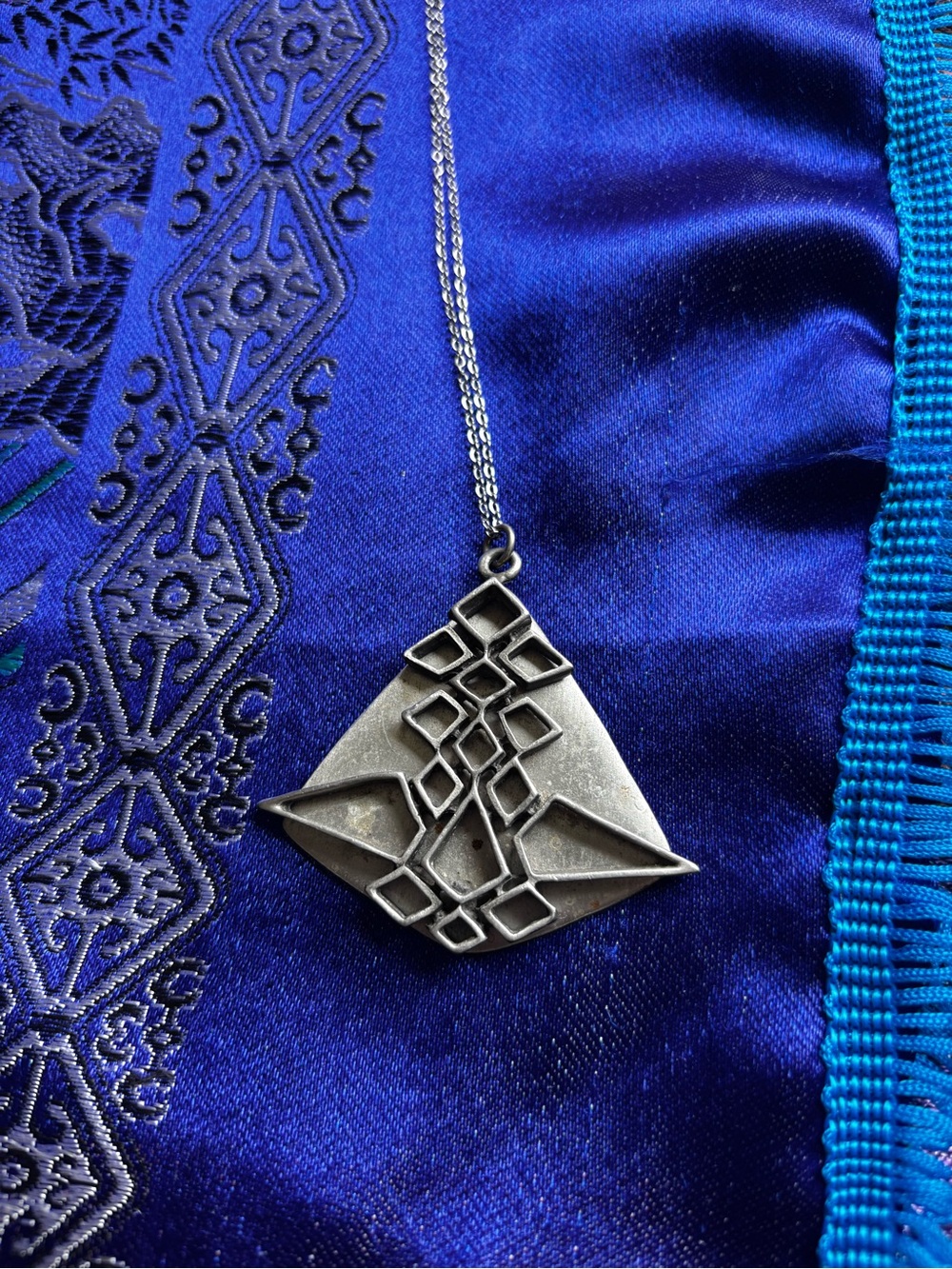 Celebrity pewter pendant